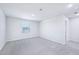 This is a light, bright, and airy bedroom with neutral walls, carpet, and a window at 571 White Birch Ln, Angier, NC 27501
