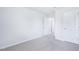 Bright bedroom features neutral carpet, white walls and ceiling, and two doors at 571 White Birch Ln, Angier, NC 27501