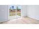 Bedroom with laminate flooring and a view through a glass sliding door to the exterior at 571 White Birch Ln, Angier, NC 27501