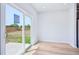 Bedroom with laminate flooring and a view through a glass sliding door to the exterior at 571 White Birch Ln, Angier, NC 27501