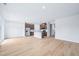 Open-concept layout showcases the kitchen with its central island and stainless steel appliances at 571 White Birch Ln, Angier, NC 27501