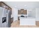 Bright kitchen featuring an island, stainless steel appliances, and wood cabinets at 571 White Birch Ln, Angier, NC 27501