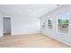 Bright and airy living room with hardwood flooring and multiple windows at 571 White Birch Ln, Angier, NC 27501