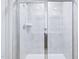 Glass door walk-in shower with tile surround at 571 White Birch Ln, Angier, NC 27501