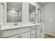 Bright bathroom boasts a double sink vanity and modern hardware and fixtures at 591 White Birch Ln, Angier, NC 27501