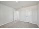 A bedroom featuring neutral walls, plush carpeting, and a closet at 591 White Birch Ln, Angier, NC 27501