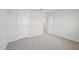 Empty bedroom featuring plush carpeting, white walls, and ample closet space at 591 White Birch Ln, Angier, NC 27501