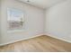 Bright bedroom with hardwood floors, a large window, and neutral walls at 591 White Birch Ln, Angier, NC 27501