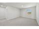 Spacious carpeted bedroom with a window and an en-suite bathroom at 591 White Birch Ln, Angier, NC 27501