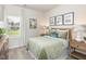 Bedroom with a window view and stylish decor featuring an accent table lamp at 591 White Birch Ln, Angier, NC 27501