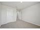Neutral bedroom with carpet features a double door closet and a single door at 591 White Birch Ln, Angier, NC 27501