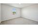 A neutral bedroom with plush carpet and a window at 591 White Birch Ln, Angier, NC 27501