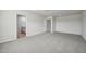 Spacious carpeted bedroom leads to a brightly lit ensuite bathroom at 591 White Birch Ln, Angier, NC 27501