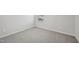 A room with plush carpet, white walls, and a window with blinds at 591 White Birch Ln, Angier, NC 27501