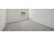 Bright bedroom features neutral carpet, light-filled window, and freshly painted walls at 591 White Birch Ln, Angier, NC 27501