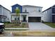 Charming two-story home with a two-car garage and a cozy front porch entrance at 591 White Birch Ln, Angier, NC 27501