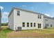 Two-story home's exterior features vinyl siding, double-hung windows and a well-maintained lawn for curb appeal at 591 White Birch Ln, Angier, NC 27501