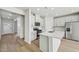 Well-lit kitchen boasting white cabinets and a kitchen island at 591 White Birch Ln, Angier, NC 27501