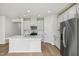 Modern kitchen featuring white cabinets, stainless appliances, and island at 591 White Birch Ln, Angier, NC 27501