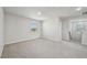 An empty living room with carpet and a window at 591 White Birch Ln, Angier, NC 27501