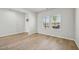 Bright living room featuring beautiful hardwood floors and natural light streaming through the windows at 591 White Birch Ln, Angier, NC 27501