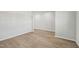 Spacious living room with hardwood floors, white walls, and ample room for furniture at 591 White Birch Ln, Angier, NC 27501