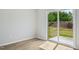 A room with wood floors and sliding glass doors leading to a view of the yard at 591 White Birch Ln, Angier, NC 27501