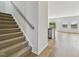 Carpeted staircase leading to the second floor of the home at 591 White Birch Ln, Angier, NC 27501