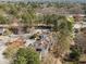 Aerial view of a community featuring plenty of parking and surrounding trees at 6001 Winterpointe Ln # 204, Raleigh, NC 27606