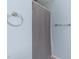 Bathroom featuring a gray shower curtain, towel ring, and grab bar on light blue walls at 6001 Winterpointe Ln # 204, Raleigh, NC 27606