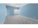 Bedroom with plush carpet, a ceiling fan, and large windows at 6001 Winterpointe Ln # 204, Raleigh, NC 27606