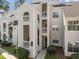 Exterior of a multi-level condo building with balconies and well-maintained landscaping at 6001 Winterpointe Ln # 204, Raleigh, NC 27606
