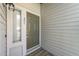 Close-up of a front door with unit number 204 next to a window at 6001 Winterpointe Ln # 204, Raleigh, NC 27606