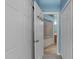Hallway with multiple storage closets and a view into the bathroom at 6001 Winterpointe Ln # 204, Raleigh, NC 27606