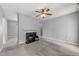 Bright living room with neutral carpet and fireplace at 6001 Winterpointe Ln # 204, Raleigh, NC 27606