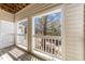 Charming outdoor patio with wood flooring and a view of trees and the neighborhood at 6001 Winterpointe Ln # 204, Raleigh, NC 27606