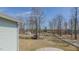 Expansive backyard with lots of room to play, mature trees, and shed at 6089 Joe Trail Ct, Mebane, NC 27302
