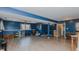 Finished basement with wood-look floors, painted blue, featuring versatile living space at 6089 Joe Trail Ct, Mebane, NC 27302