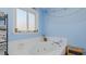 Bathroom with a jacuzzi tub and white tile at 6089 Joe Trail Ct, Mebane, NC 27302