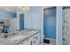 Bathroom featuring a dual sink vanity with granite countertops and white cabinets at 6089 Joe Trail Ct, Mebane, NC 27302
