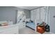 Shared ' bedroom with two twin beds and creative tree-themed wall art at 6089 Joe Trail Ct, Mebane, NC 27302