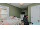 Cozy bedroom with light-green walls, a window view, and a comfortable bed at 6089 Joe Trail Ct, Mebane, NC 27302