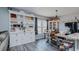 Open-concept dining area with a large, decorative hutch and modern lighting at 6089 Joe Trail Ct, Mebane, NC 27302