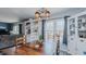 View of a dining area in a transitional home showing a large table and cabinets at 6089 Joe Trail Ct, Mebane, NC 27302