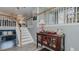 Inviting entryway featuring light gray walls, wooden railings, and decorative accents at 6089 Joe Trail Ct, Mebane, NC 27302