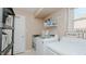 Functional laundry room with modern washer and dryer, plus folding station at 6089 Joe Trail Ct, Mebane, NC 27302