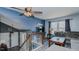 Cozy living room with natural light, stairs, and a comfortable seating area at 6089 Joe Trail Ct, Mebane, NC 27302