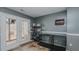 Mud room with neutral gray walls, tile floors, and access to outdoor area at 6089 Joe Trail Ct, Mebane, NC 27302