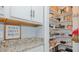 Pantry area with shelves for storage with a counter and decor sign at 6089 Joe Trail Ct, Mebane, NC 27302