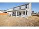 Exterior view of the home highlighting the covered patio and spacious backyard at 65 Hickory Run Ln, Franklinton, NC 27525